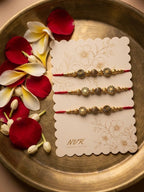 NVR Set of 3 Red & Gold Toned Artificial Stones & Beads Thread Rakhi With Roli Chawal | Grocsy