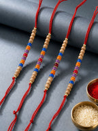 NVR Set of 4 Multicolor Circular Beads Studded Thread Rakhi with Roli Chawal Chandan | Grocsy