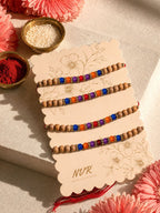 NVR Set of 4 Multicolor Circular Beads Studded Thread Rakhi with Roli Chawal Chandan | Grocsy