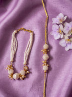 NVR Set of 2 Gold Toned & White Pearls Bhaiya Bhabhi Rakhi with Roli Chawal Chandan Mishri | Grocsy