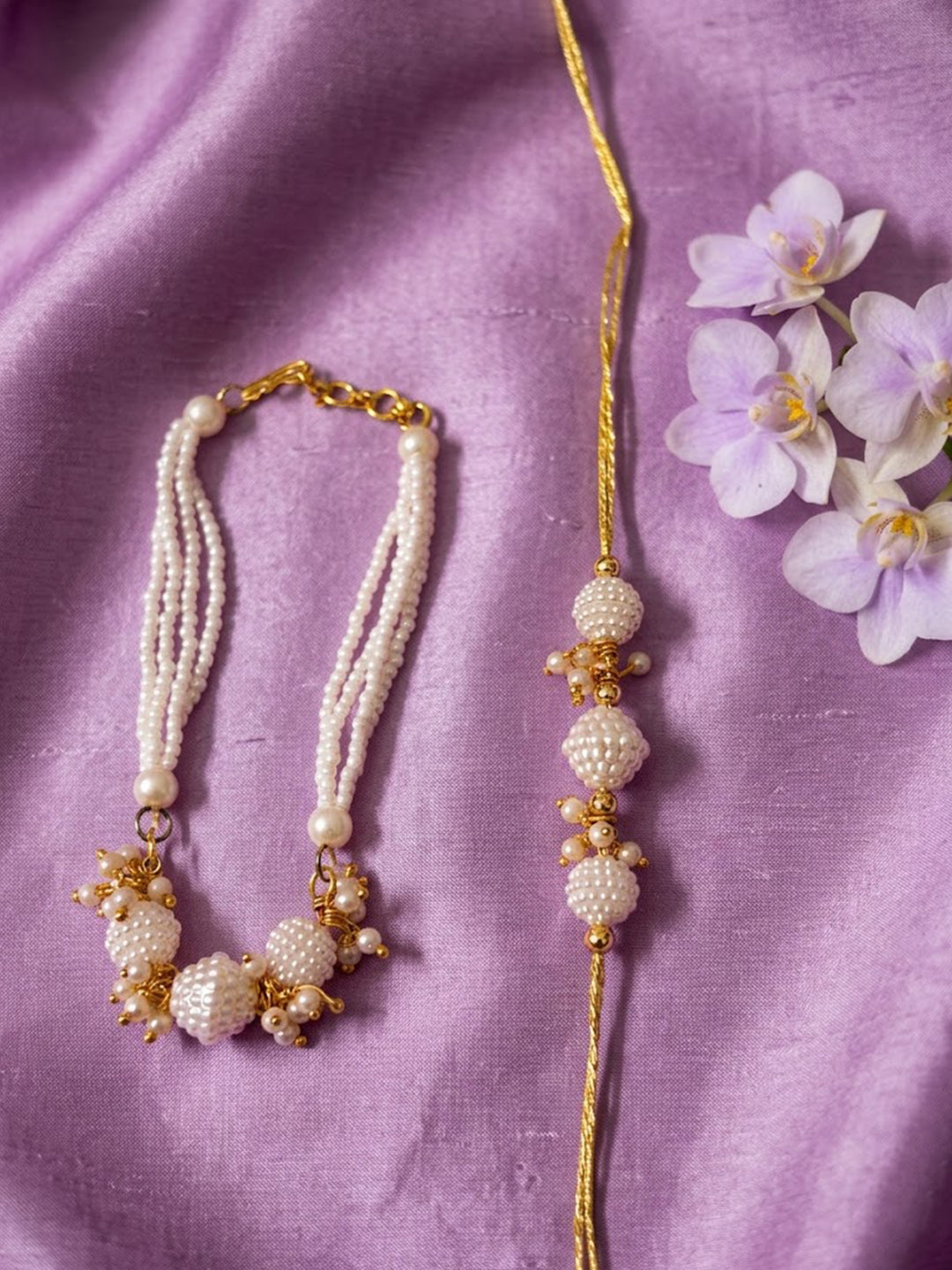 NVR Set of 2 Gold Toned & White Pearls Bhaiya Bhabhi Rakhi with Roli Chawal Chandan Mishri | Grocsy