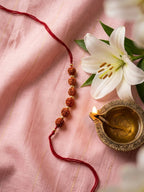 NVR Religious Rudraksh Thread Rakhi With Roli Chawal Chandan Mishri | Grocsy