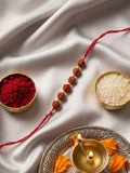 NVR Religious Rudraksh Thread Rakhi With Roli Chawal Chandan Mishri | Grocsy