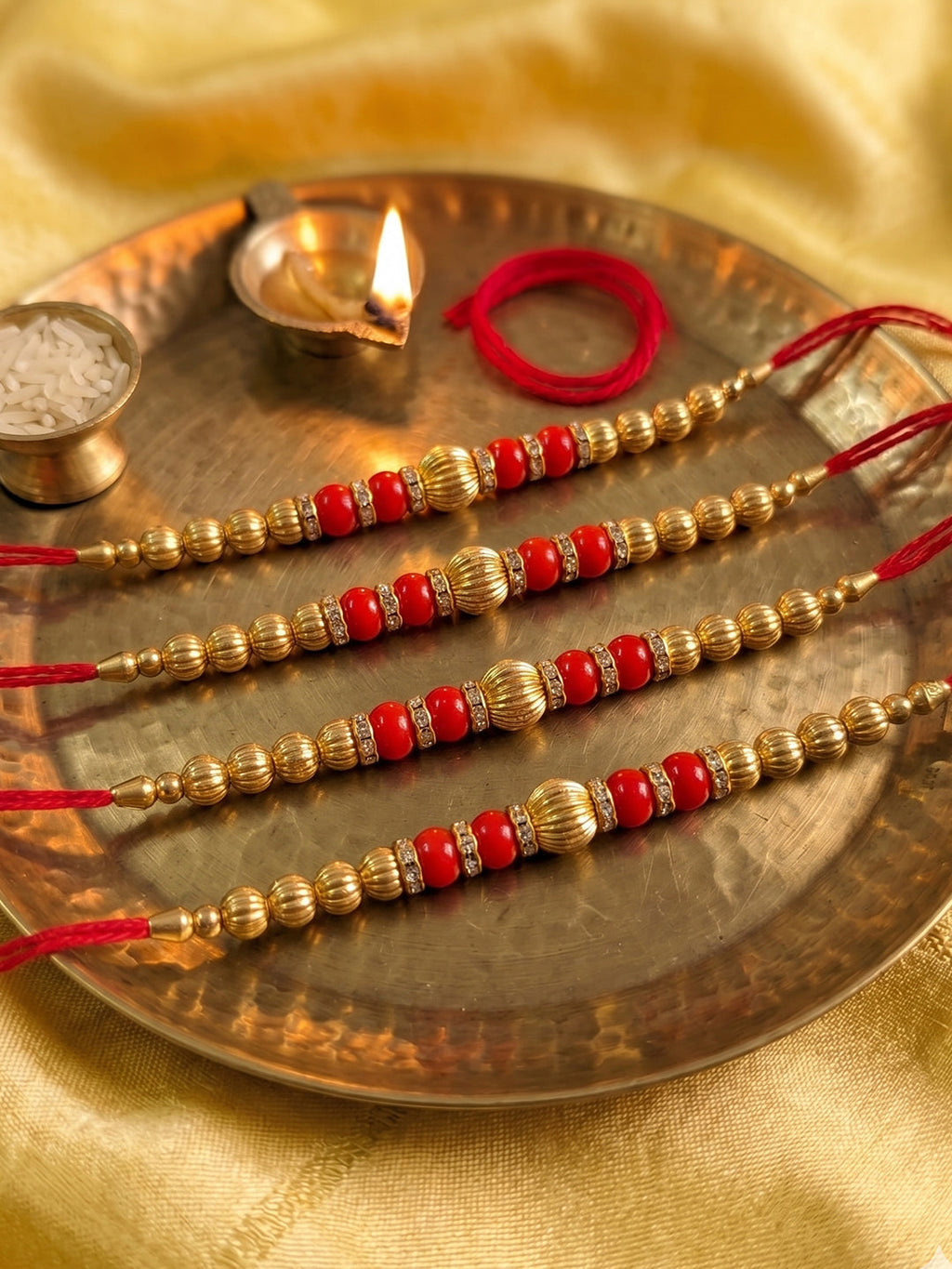 NVR Set of 4 Artificial Beads Red Thread Rakhi With Roli Chawal Chandan Mishri | Grocsy