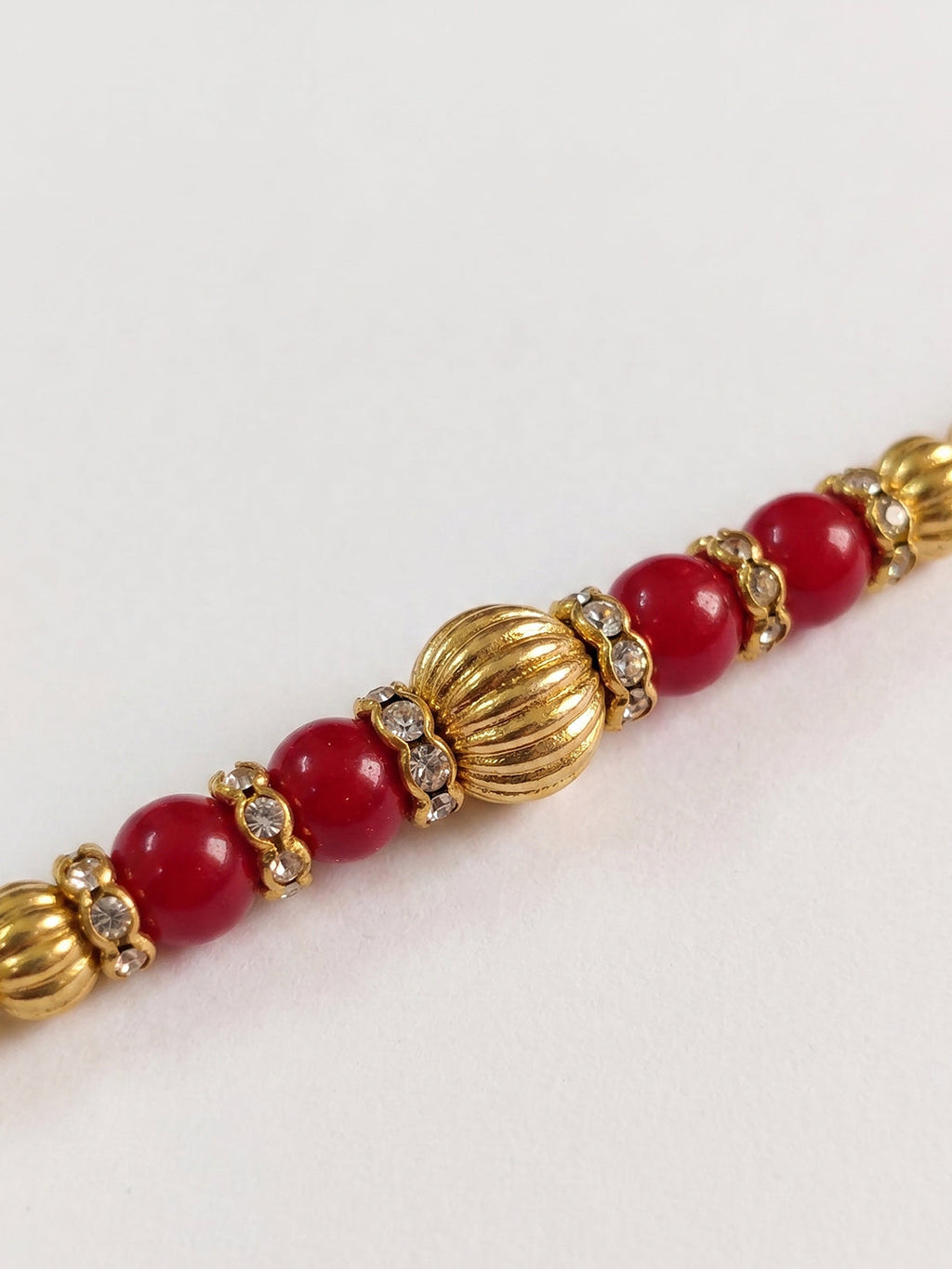 NVR Set of 4 Artificial Beads Red Thread Rakhi With Roli Chawal Chandan Mishri | Grocsy