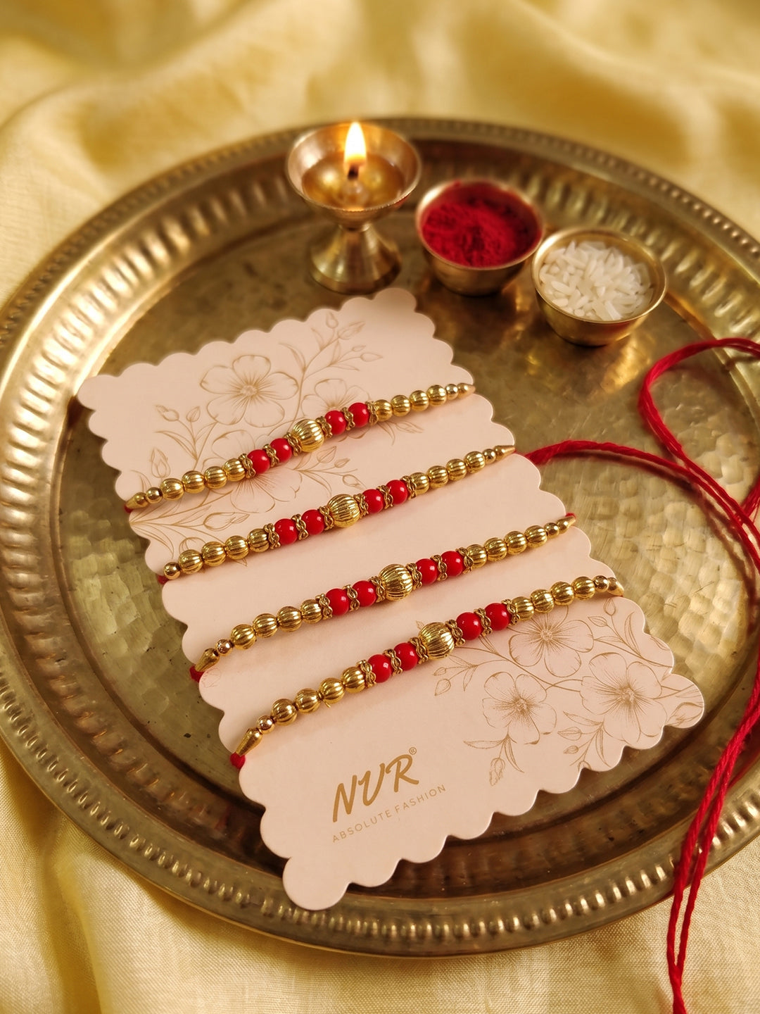 NVR Set of 4 Artificial Beads Red Thread Rakhi With Roli Chawal Chandan Mishri | Grocsy