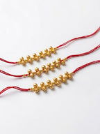 NVR Set of 3 Gold Toned Ghungroo & Red Thread Rakhi With Roli Chawal Chandan Mishri | Grocsy