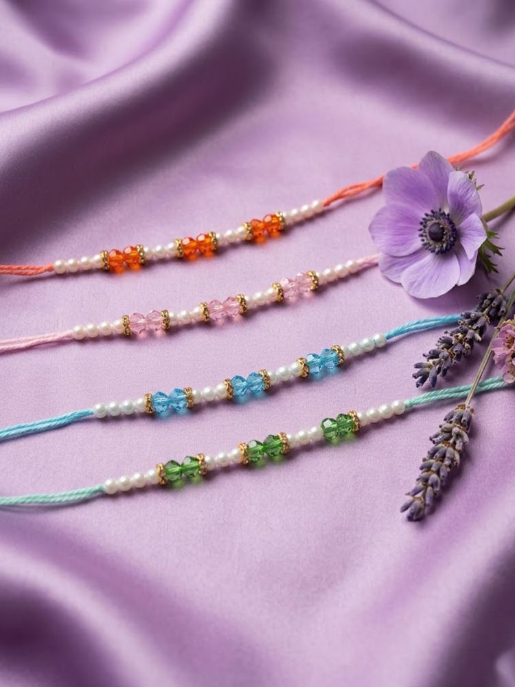 NVR Set of 4 White Pearls & Multicolor Thread Rakhi With Roli Chawal Chandan Mishri | Grocsy