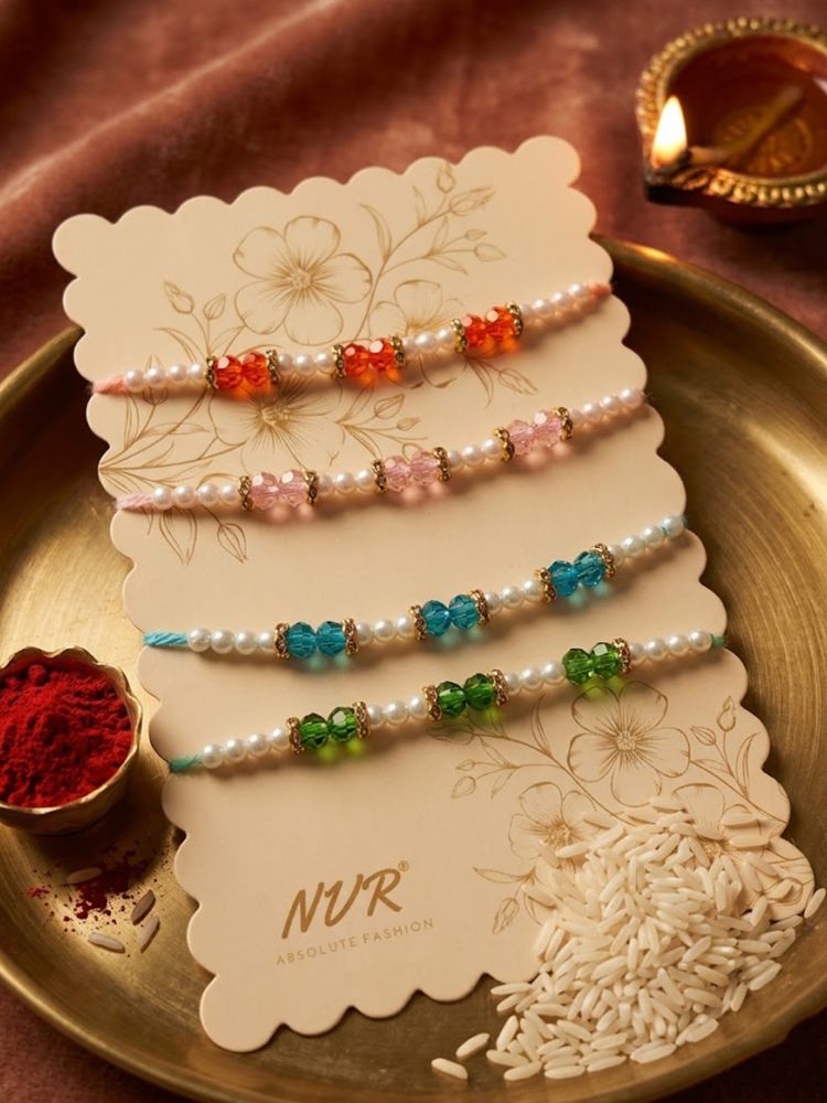 NVR Set of 4 White Pearls & Multicolor Thread Rakhi With Roli Chawal Chandan Mishri | Grocsy