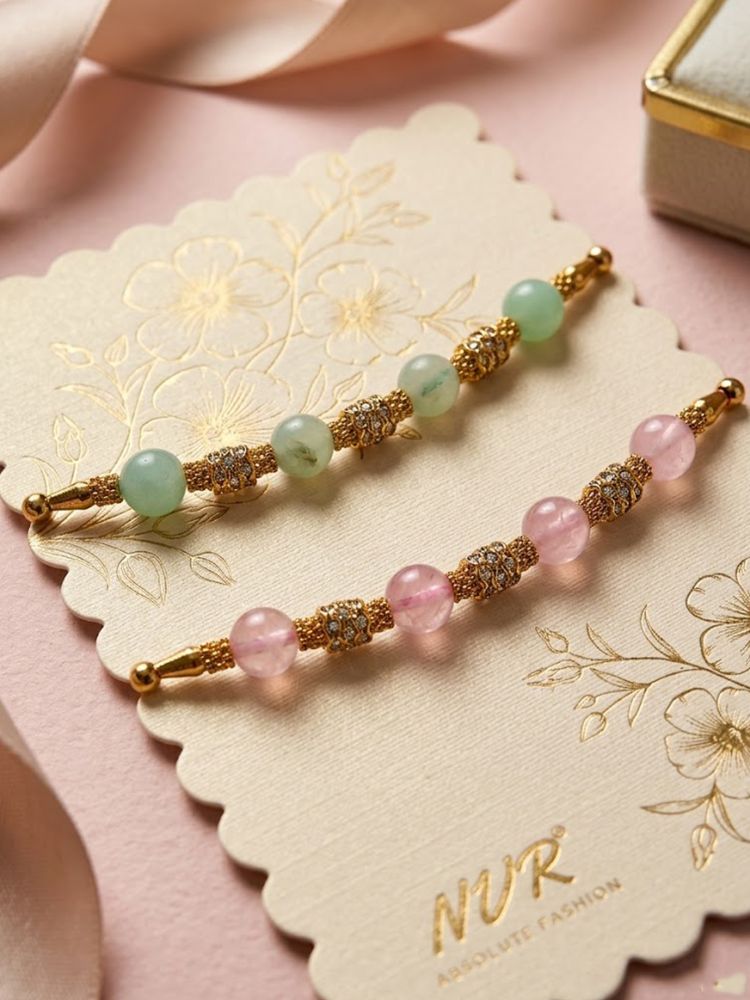 NVR Set of 2 Pink & Green Artificial Beads Thread Rakhi With Roli Chawal Chandan Mishri | Grocsy