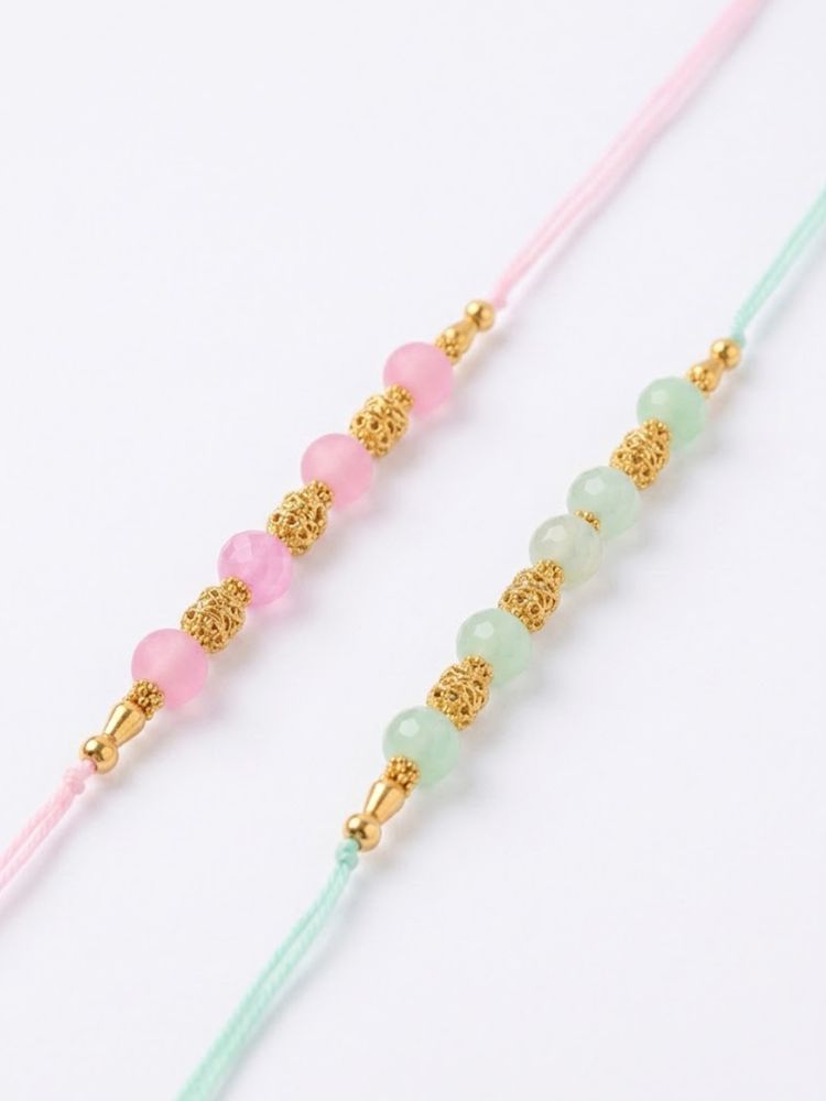 NVR Set of 2 Pink & Green Artificial Beads Thread Rakhi With Roli Chawal Chandan Mishri | Grocsy