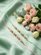 NVR Set of 2 Pink & Green Artificial Beads Thread Rakhi With Roli Chawal Chandan Mishri | Grocsy