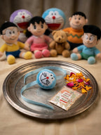 NVR Kids Doremon Design Thread Rakhi With Roli Chawal Chandan Mishri | Grocsy