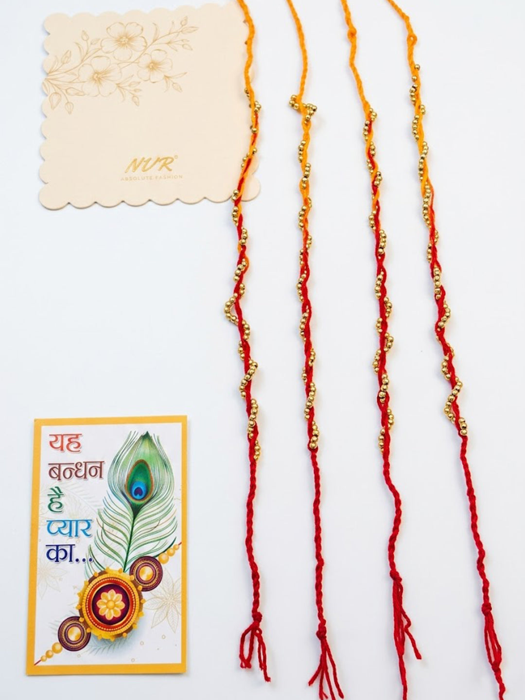 NVR Set of 4 Red & Yellow Thread Rakhi with Roli Chawal Chandan Mishri | Grocsy