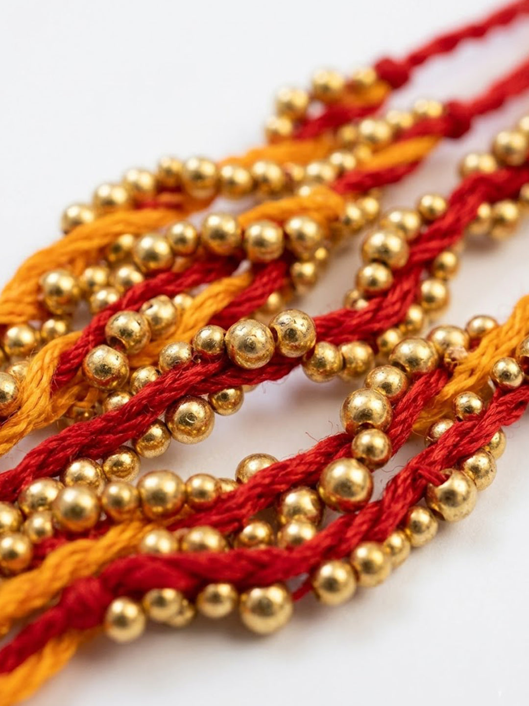 NVR Set of 4 Red & Yellow Thread Rakhi with Roli Chawal Chandan Mishri | Grocsy