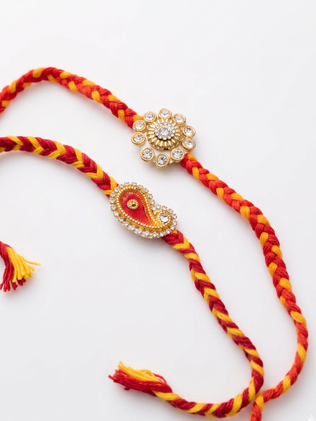 NVR Set of 2 Gold & Red Thread & Kundan Rakhi with Roli Chawal Chandan Mishri | Grocsy