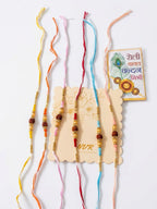 NVR Set of 6 Rudraksh & Artificial Beads Thread Rakhi with Roli Chawal Chandan Mishri | Grocsy