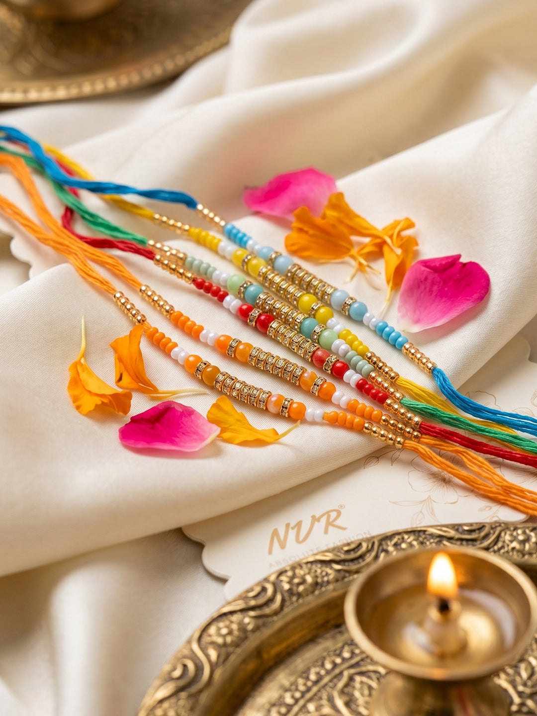 NVR Set of 6 Multi Artificial Beads Thread Rakhi with Roli Chawal Chandan Mishri | Grocsy