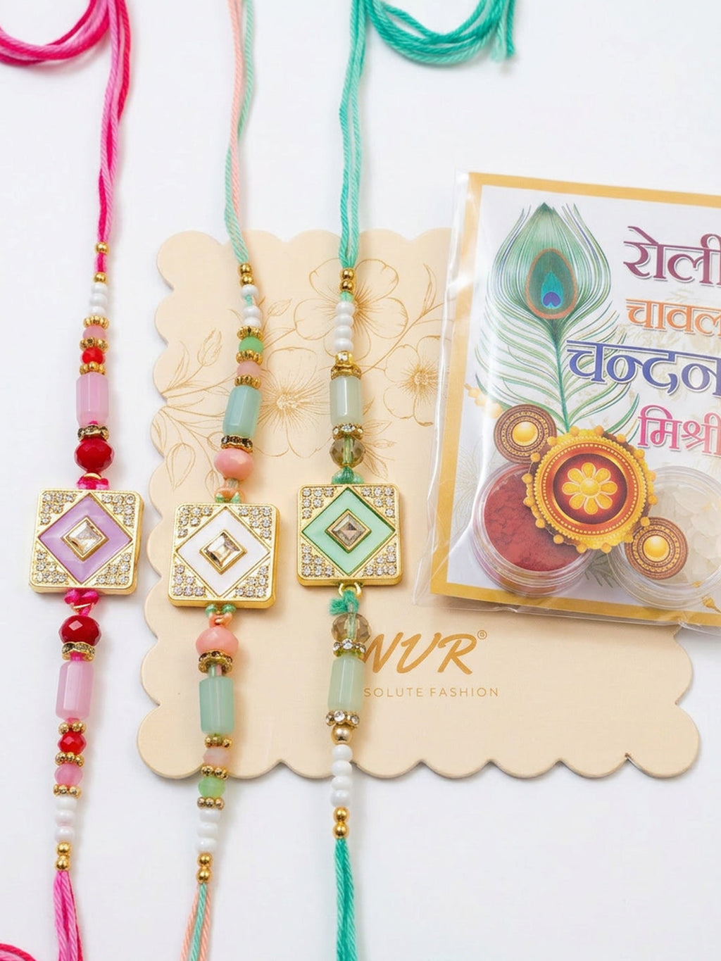 NVR Set of 3 Multicolor AD Thread Rakhi with Roli Chawal Chandan Mishri | Grocsy