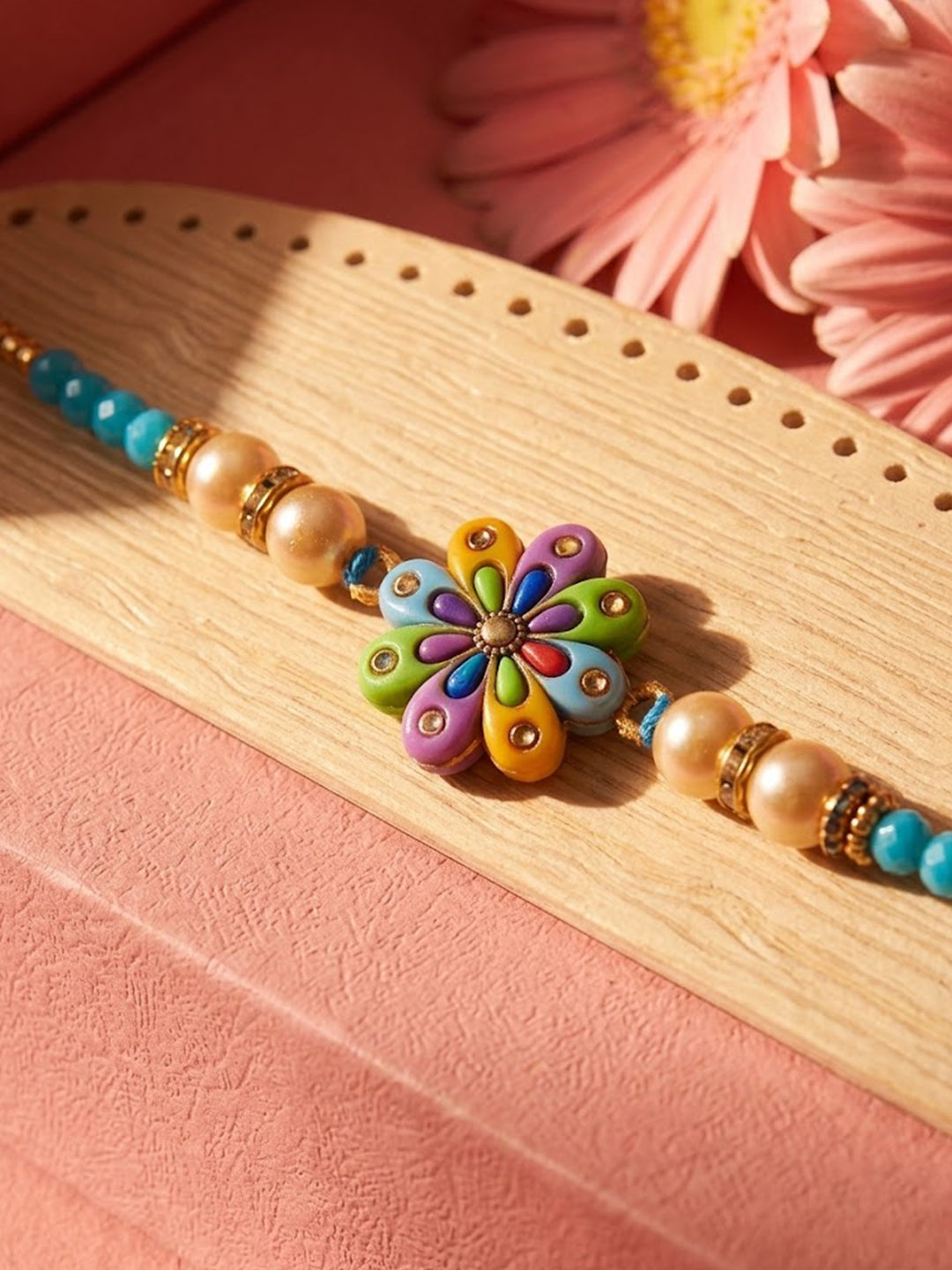 NVR Artificial Beads Flower Shape Multicolor Thread Rakhi with Roli Chawal Chandan Mishri | Grocsy