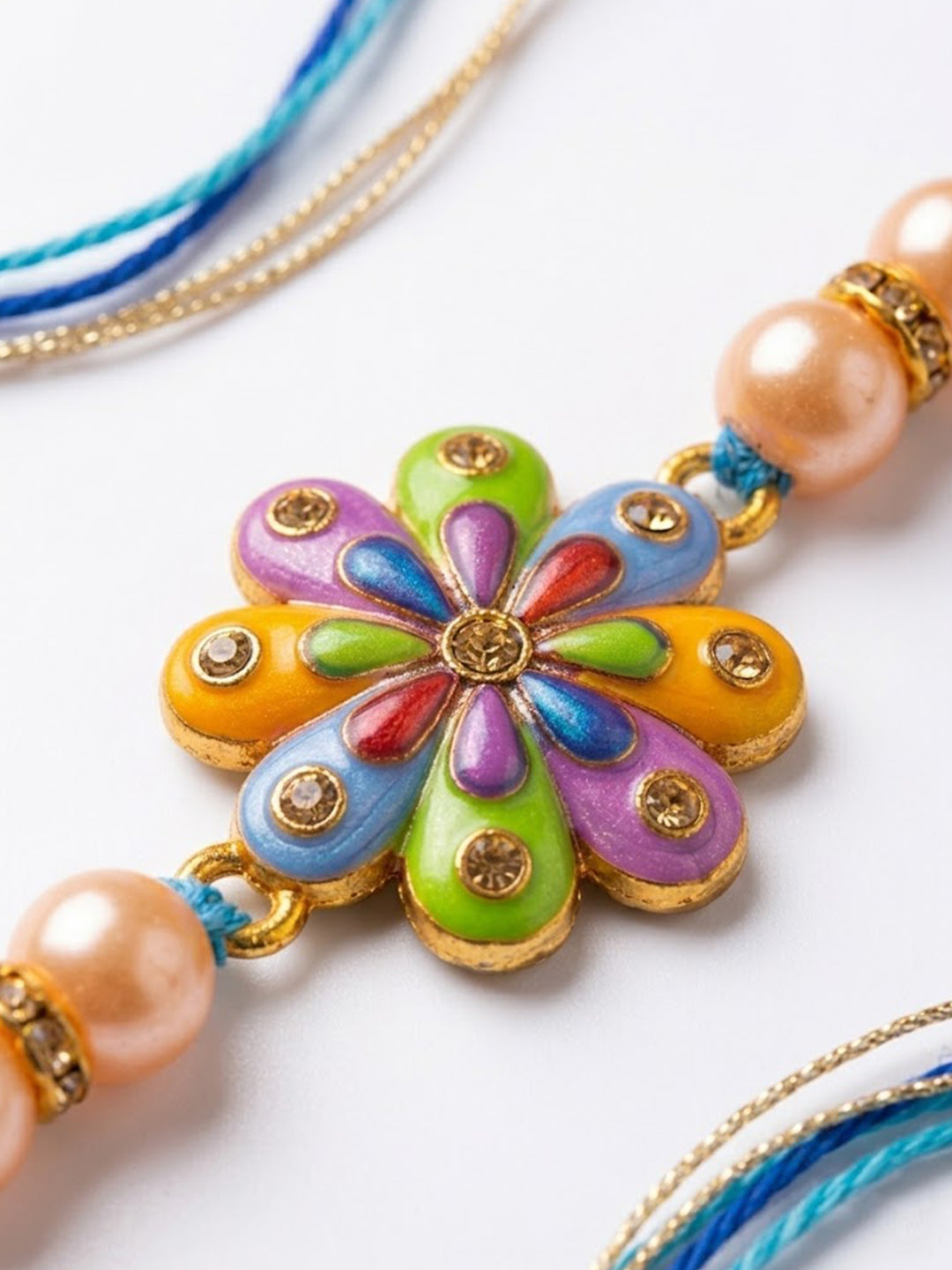 NVR Artificial Beads Flower Shape Multicolor Thread Rakhi with Roli Chawal Chandan Mishri | Grocsy
