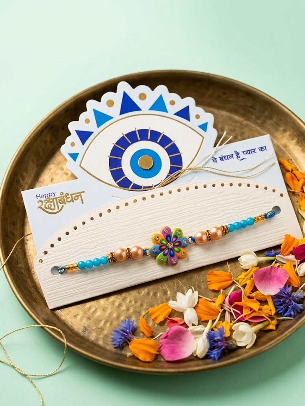 NVR Artificial Beads Flower Shape Multicolor Thread Rakhi with Roli Chawal Chandan Mishri | Grocsy