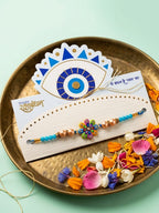 NVR Artificial Beads Flower Shape Multicolor Thread Rakhi with Roli Chawal Chandan Mishri | Grocsy