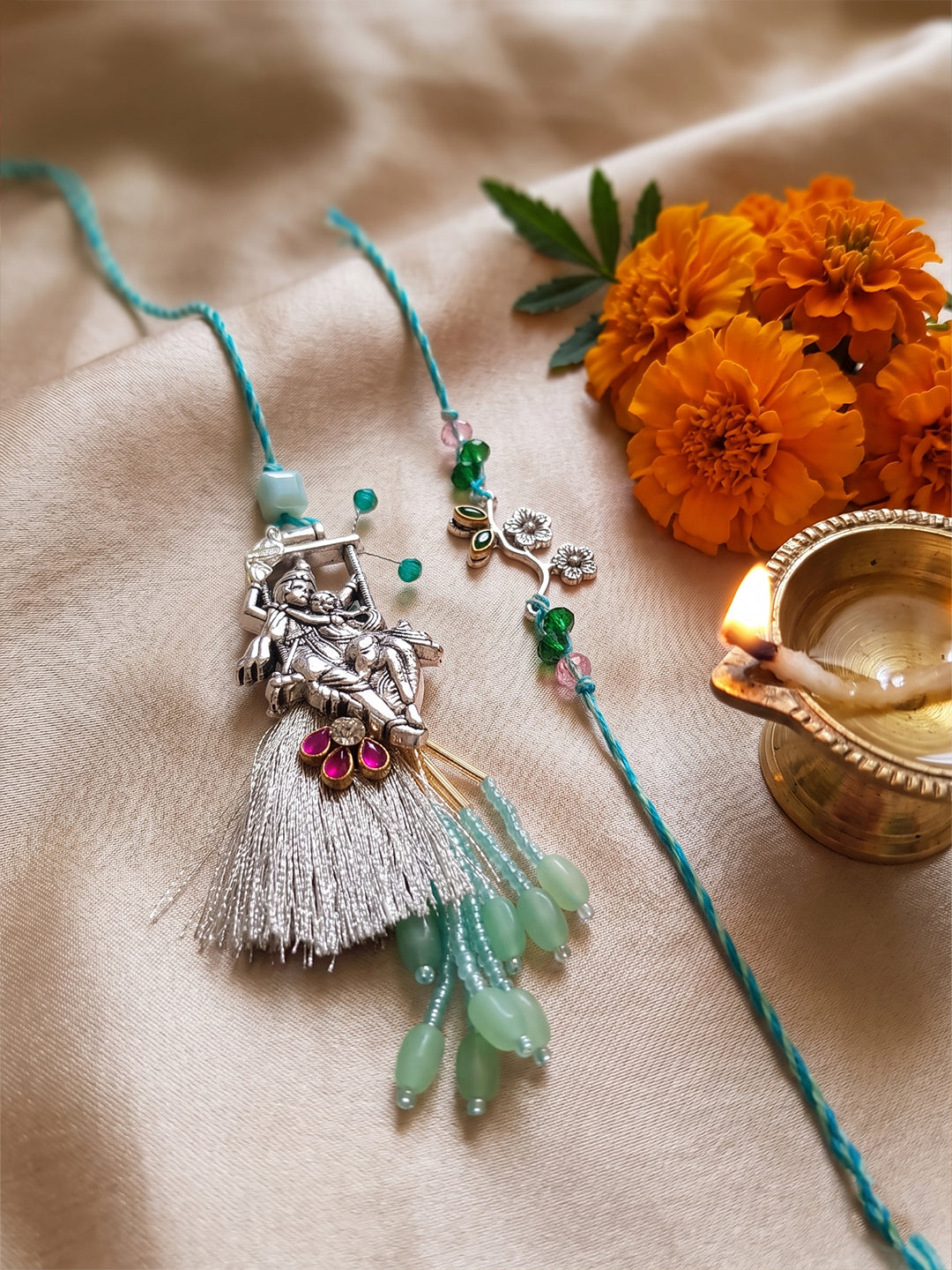 NVR Set of 2 Designer Religious Silver Toned Bhaiya Bhabhi Rakhi with Roli Chawal Chandan | Grocsy