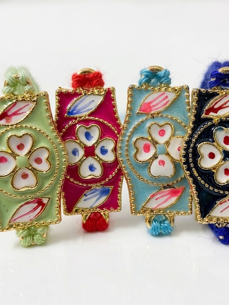 NVR Set of 4 Multicolor Heart Shape Thread Rakhi with Roli Chawal Chandan Mishri | Grocsy