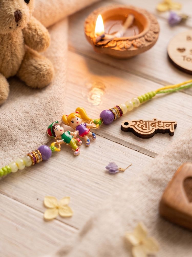 NVR Kids Multicolor Artificial Beads Thread Rakhi with Roli Chawal Chandan Chandan Mishri | Grocsy