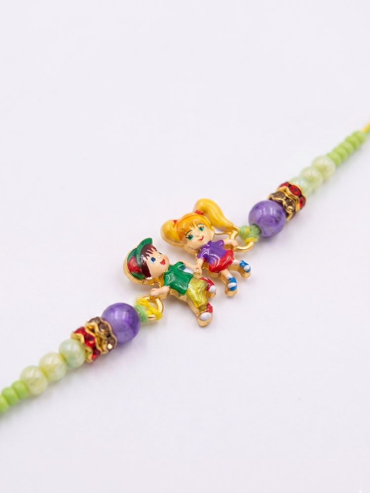 NVR Kids Multicolor Artificial Beads Thread Rakhi with Roli Chawal Chandan Chandan Mishri | Grocsy