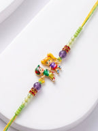 NVR Kids Multicolor Artificial Beads Thread Rakhi with Roli Chawal Chandan Chandan Mishri | Grocsy