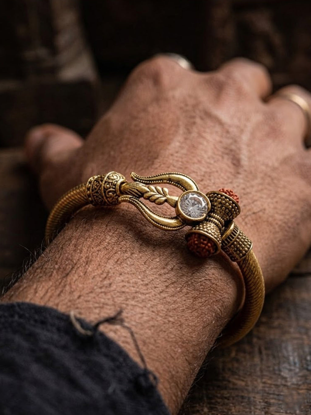 NVR Gold Plated Trishool Design Rudraksh Rakhi Bracelet with Roli Chawal Chandan Mishri | Grocsy