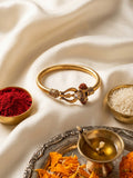 NVR Gold Plated Trishool Design Rudraksh Rakhi Bracelet with Roli Chawal Chandan Mishri | Grocsy