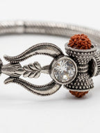 NVR Silver Plated Trishool Design Rudraksh Rakhi Bracelet with Roli Chawal Chandan Mishri | Grocsy
