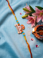 NVR Stylish Artificial Beads Kids Thread Rakhi with Roli Chawal Chandan Mishri | Grocsy