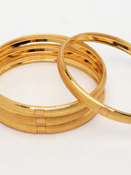 NVR Women's Set of 4 Gold-Polished Traditional Bangles | Grocsy
