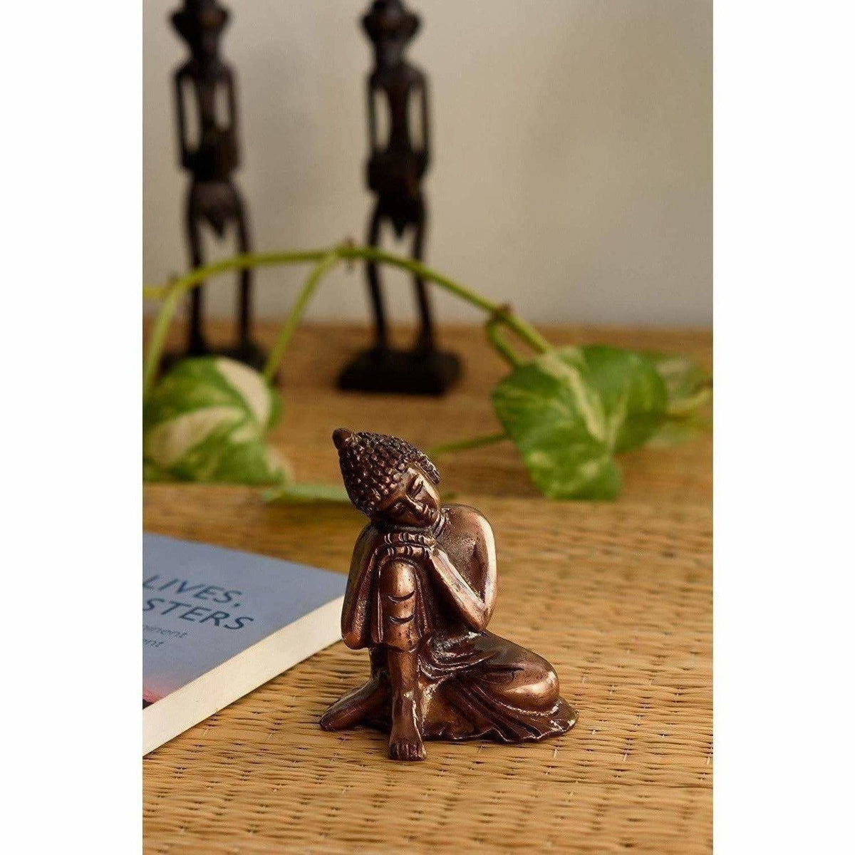 Resting Buddha on Knee Metal Showpiece, Brown | Grocsy