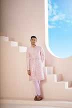 A Pink Sherwani Featuring Elegant Cross-Line Patterns Adorned With Intricate Floral Designs by Hilo Design | Grocsy