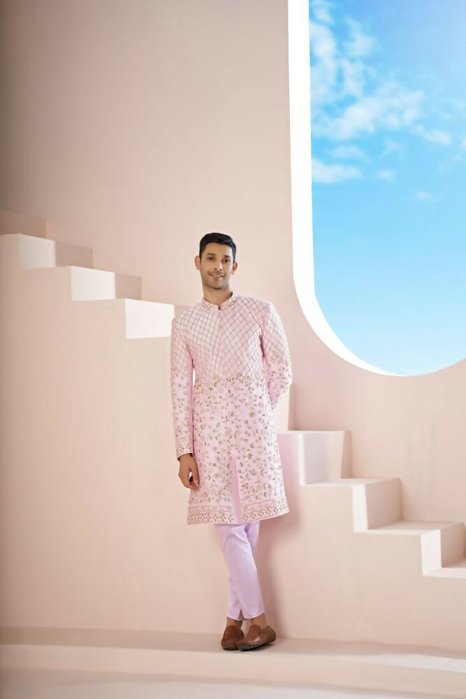 A Pink Sherwani Featuring Elegant Cross-Line Patterns Adorned With Intricate Floral Designs by Hilo Design | Grocsy
