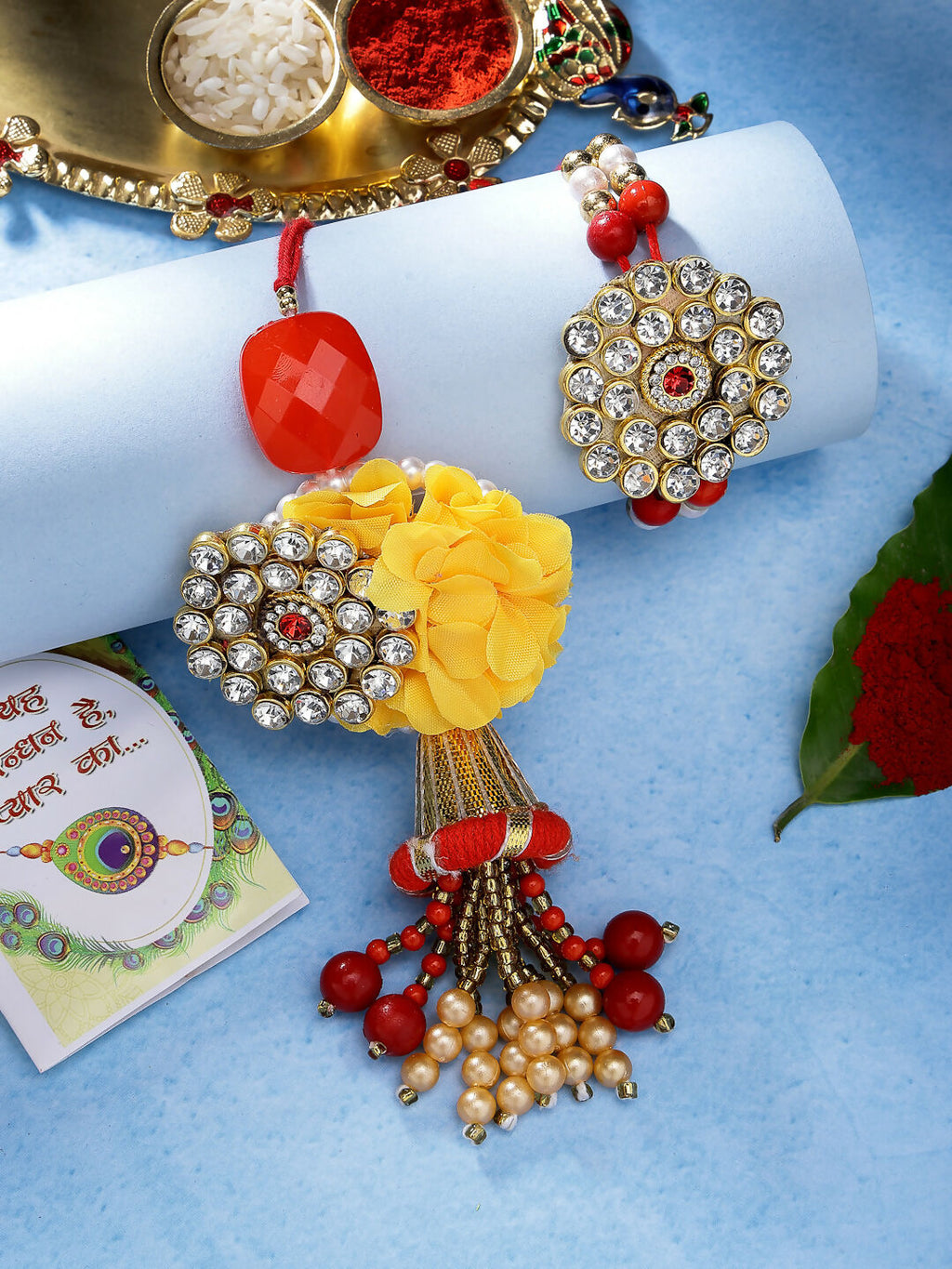 NVR Women & Men Set of 2 Red & Gold-Toned Stone-Studded & Beaded Bhaiya Bhabhi Rakhi With Roli Chawal & Chocolate | Grocsy