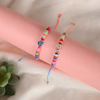 NVR Women & Men Set of 2 Multicolor Evil Eye Rakhi With Roli Chawal | Grocsy