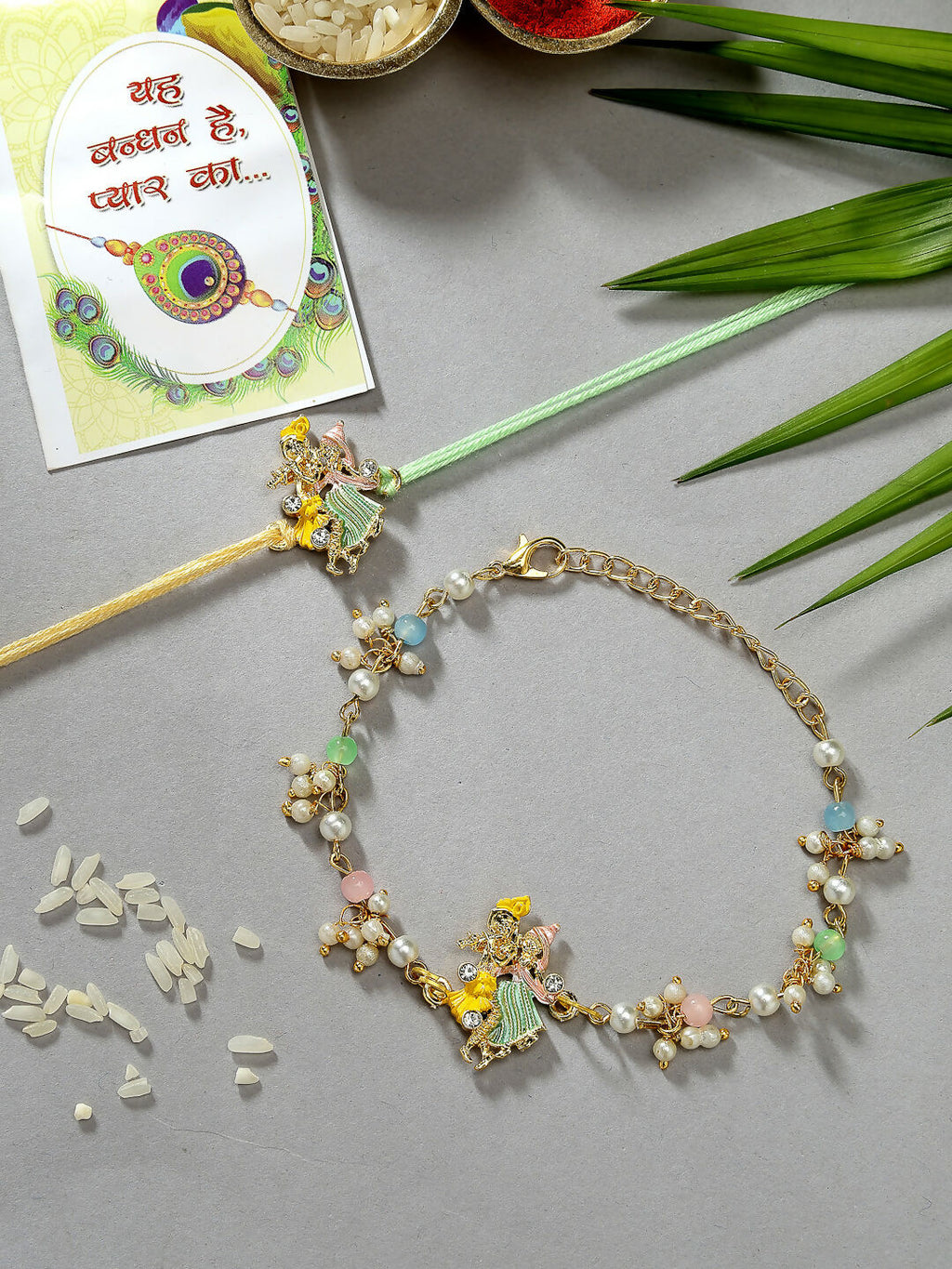 NVR Women & Men Set of 2 Multicolor Gold-Toned Radha Krishna Beaded Bhaiya Bhabhi Rakhi With Roli Chawal & Chocolate | Grocsy