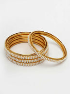 NVR Women's Set of 4 Gold-Polished Pearl Handcrafted Traditional Bangles | Grocsy