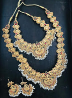 Jewel City Gold-Plated Traditional Goddess Lakshmi Temple Jewellery Bridal Set with Ruby Stone Long Haram Double Necklace Set | Grocsy