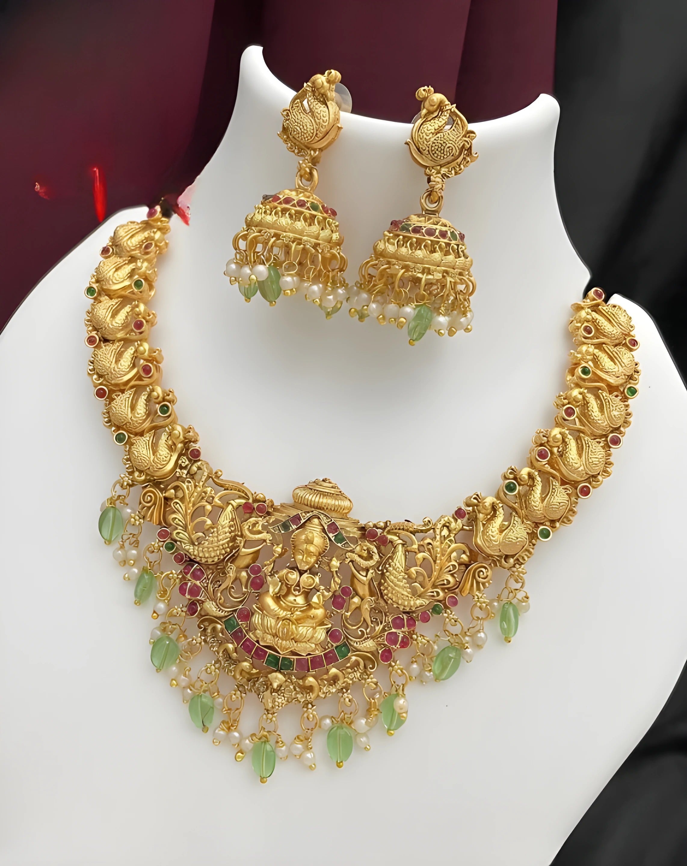 Jewel City Opulent Gold Peacock Lakshmi Temple Necklace Set - Handcrafted Antique Finish Bridal Jewelry with Emerald & Pearl Accent | Grocsy