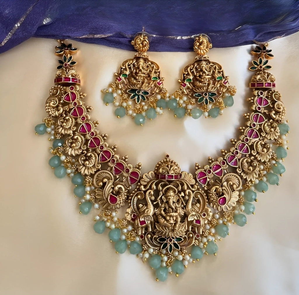 Jewel City Exquisite Ganesha Temple Jewelry Set - Antique Gold-Plated Necklace and Earrings with Ruby Pink Stones & Mint Green Beads (Premium Designer Collection) | Grocsy