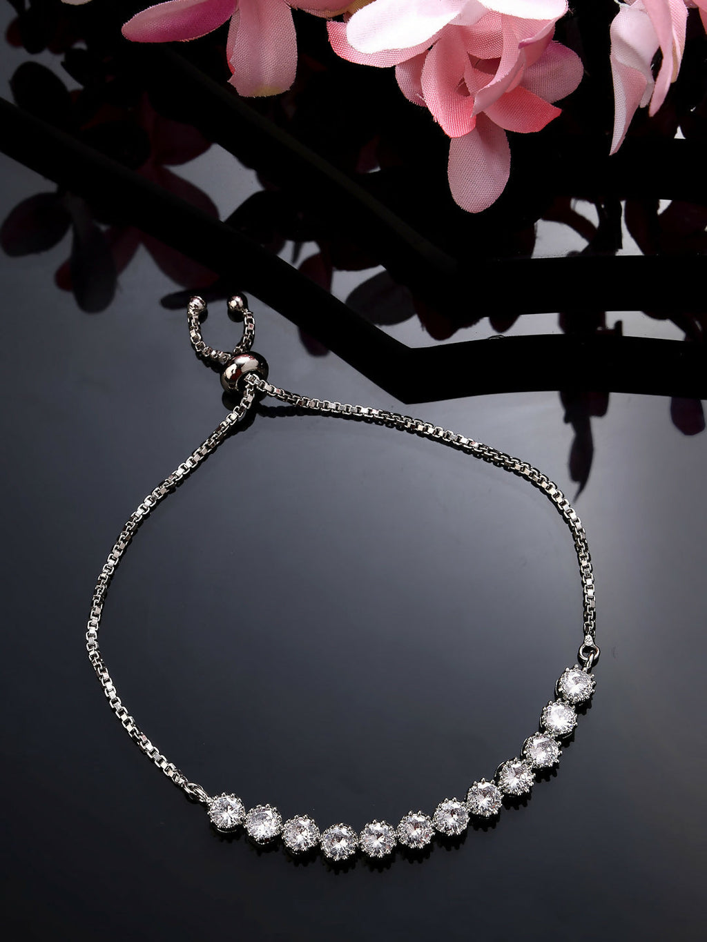 NVR Women Silver-Plated American Diamond Studded Rakhi With Roli Chawal | Grocsy