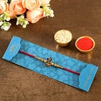 Devotional Lord Ganesha Rakhi & Kaju Roll Box | Grocsy