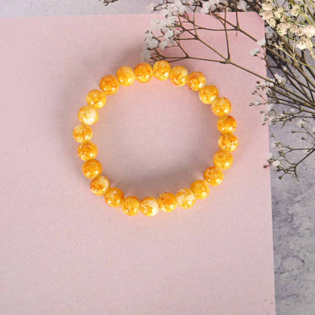 NVR Men & Women Yellow Marbel Crystal Elasticated Bracelet | Grocsy